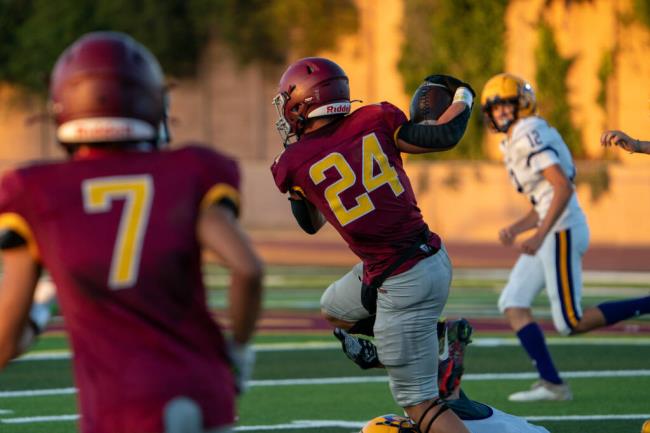 Piner’s Jose Sanchez, 24, sidesteps a Middletown defender for a 10-yard gain on Friday, Aug. 25, 2023 in Santa Rosa. (Nicholas Vides/ For The Press Democrat)